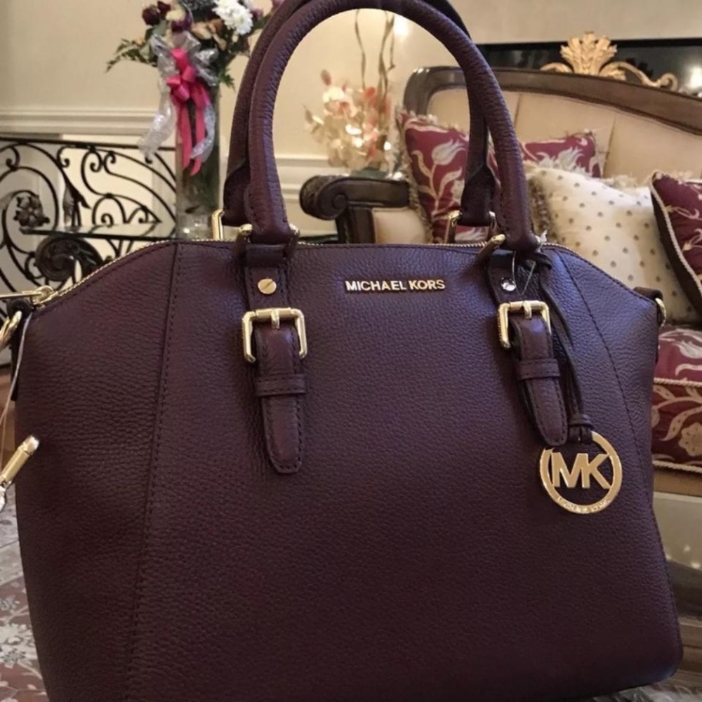 MICHAEL KORS wine/burgundy leather medium size bag.